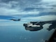A U.S. Air Force F-15C Eagle from the 159th Fighter Wing flies alongside a B-52H Stratofortress  during air-to-air integration training, April 29, 2025. The training enhanced interoperability between active-duty and Air National Guard aircrews, reinforcing their ability to operate as a cohesive force in complex airspace. (U.S. Air Force photo by Lt. Col. Matthew Dougherty)