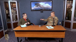 two people sitting at table