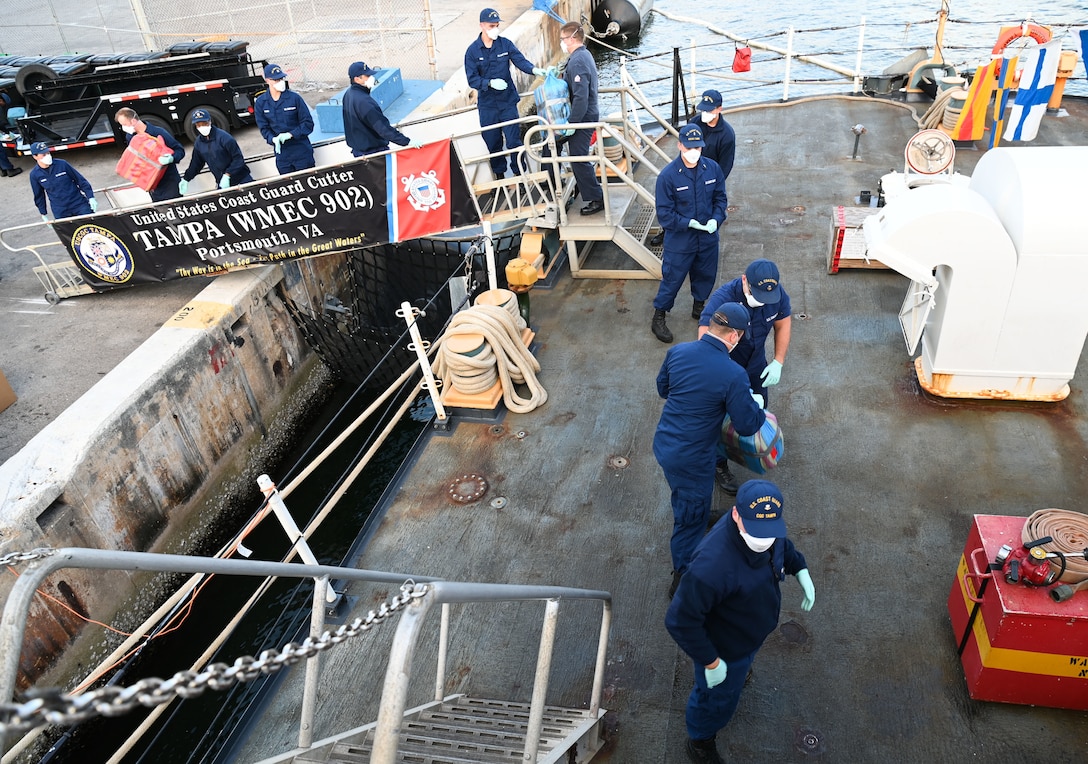 Crew members aboard USCGC Tampa (WMEC 902) offload 59 bales of illicit drugs worth more than $12 million at Port Everglades in Fort Lauderdale, Florida, April 30, 2025. The seized contraband was the result of two interdictions in the Caribbean Sea by the crew of USS Minneapolis-Saint Paul and their embarked Navy helicopter and Coast Guard law enforcement detachments. (U.S. Coast Guard photo by Petty Officer 1st Class Diana Sherbs)