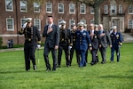 U.S. Coast Guard Academy Regimental Staff, Chad A. Asplund (’92), Cmdr. Brian A. Kudrle (’05), Richard James Andrews (’67), Daniel E. Ward (’96), and Superintendent Rear Adm. Michael J. Johnston, (left to right) pass by the regiment during a regimental review at the U.S. Coast Guard Academy, New London, Conn., April 29, 2025. The Hall of Heroes, established in April 2005, honors U.S. Coast Guard Academy graduates who performed heroic service to the Coast Guard. (U.S. Coast Guard photo by Petty Officer Third Class Leo Avila.)