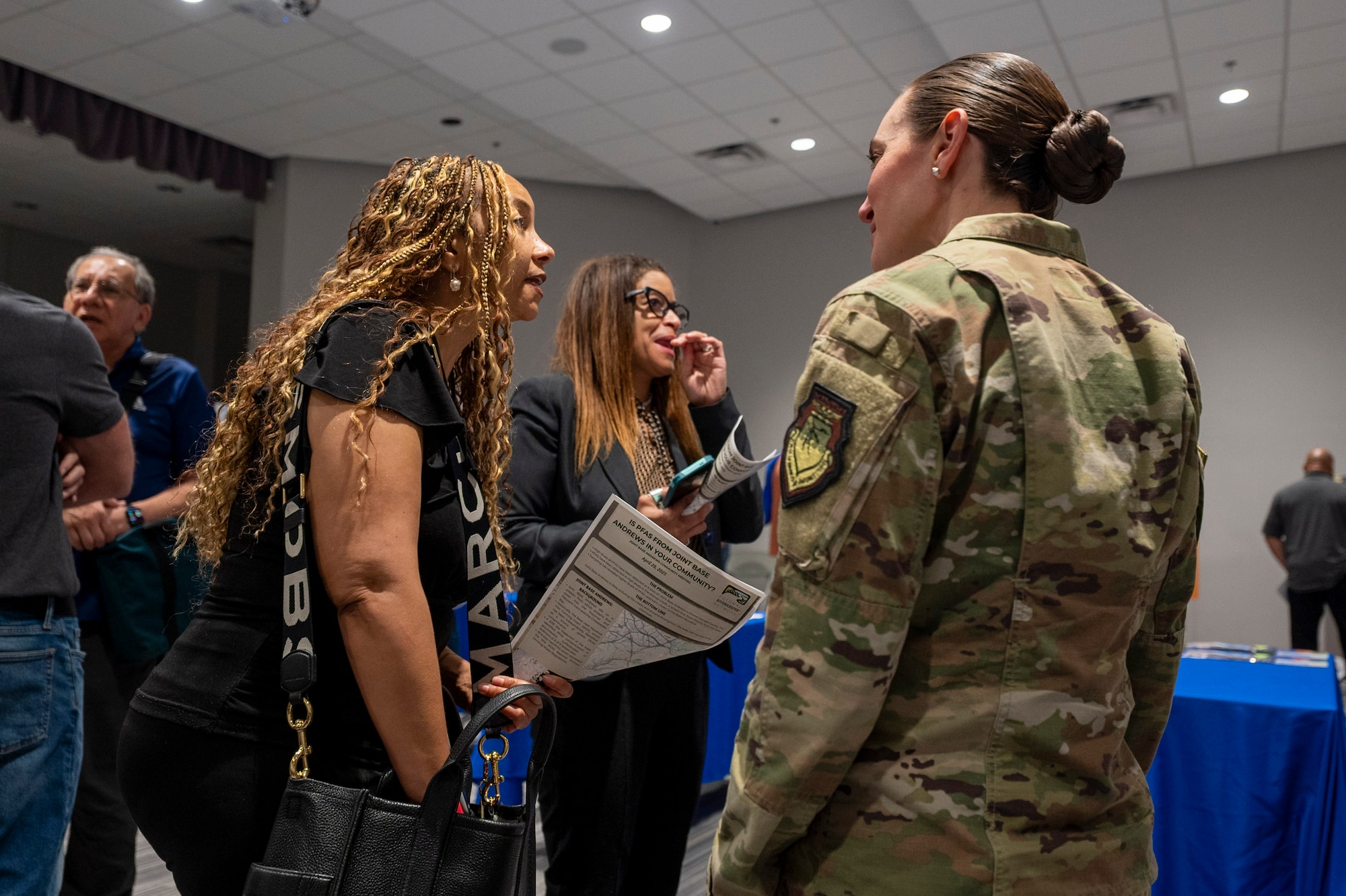 Photo of Airmen and community members
