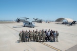 Fleet Readiness Center Southwest's safety team gathers on the test line at Naval Air Station North Island in front of a CMV-22 Osprey to celebrate the command’s selection for the Chief of Naval Operations Aviation Safety Award.