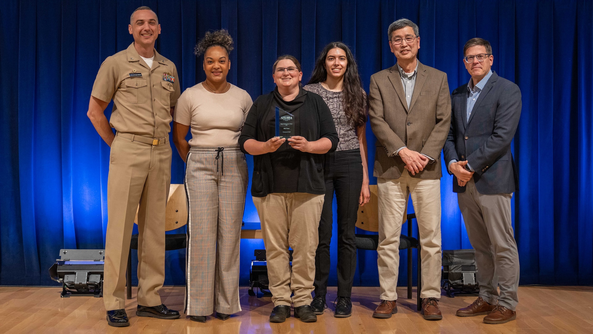 Naval Surface Warfare Center, Carderock Division leadership stands with the award winners of the Command Leadership Department’s High Performance Team award at an annual Command Awards Ceremony in West Bethesda, Md. on April 29, 2025. From left: Carderock Commanding Officer, Capt. Chris Matassa, Anna Rucker, Katherine Citro, Julia Medina, Carderock Acting Technical Director, Dr. Paul Shang and Deputy Division Technical Director, Dr. Dave Drazen.