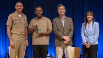 Devante Jarod Harden (center left) stands with Naval Surface Warfare Center, Carderock Division leadership at an annual Command Awards Ceremony after being recognized as the Corporate Operations Department 2024 Rising Star award recipient in West Bethesda, Md. on April 29, 2025.