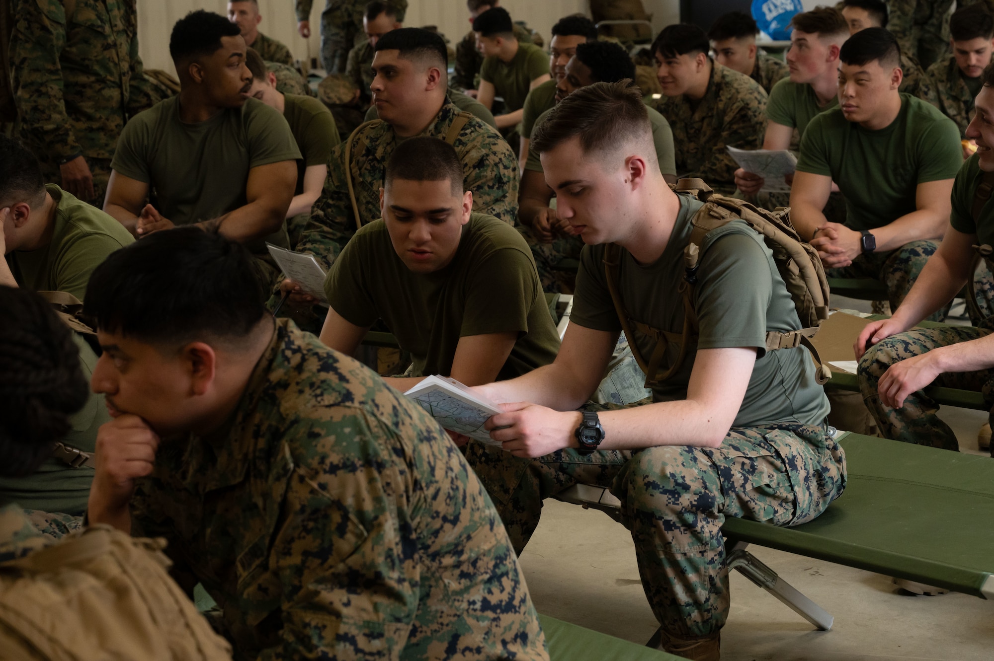 U.S. Marine Corps Marines assigned to Marine Aircraft Group 49 review a map during a lland navigation class at Joint Base McGuire-Dix-Lakehurst, N.J., April 25, 2025. MAG-49 Marines trained in weapons qualification, land navigation and Chemical, Biological, Radiological, and Nuclear (CBRN) defense as a part of routine training.U.S. Air Force photo by Airman 1st Class Luisa E. Dugan)
