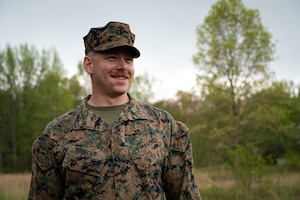 U.S. Marine Corps Maj. Mark Krueger, Marine Aircraft Group 49 logistics officer, posesfor a photo during a land navigation exercise at Joint Base McGuire-Dix-Lakehurst, N.J.,April 25, 2025. MAG-49 is a U.S. Marine Corps aviation unit ready to aid and reinforce Marine forces through various operations and national emergencies.(U.S. Air Force photo by Airman 1st Class Luisa E. Dugan)