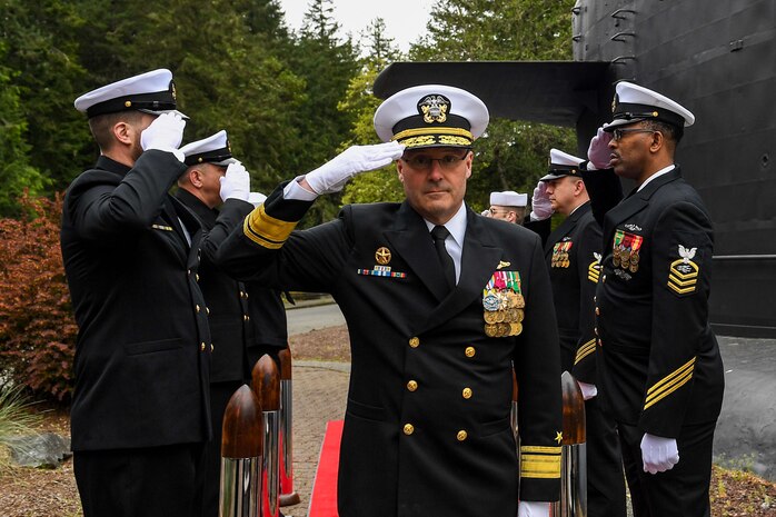 Rear Adm. Thomas Wall arrives to a change of command ceremony at Naval Base Kitsap-Bangor, April 29, 2025. During the ceremony Rear Adm. Christopher Nash relieved Wall as commander of Submarine Group (SUBGRU) 9. SUBGRU-9 exercises administrative control authority for assigned submarine commands and units in the Pacific Northwest providing oversight for shipboard training, personnel, supply and material readiness of SSBNs and their crews. SUBGRU-9 is also responsible for nuclear submarines undergoing conversion or overhaul at Puget Sound Naval Shipyard in Bremerton, Washington. (U.S. Navy photo by Mass Communication Specialist 2nd Class Gwendelyn L. Ohrazda)
