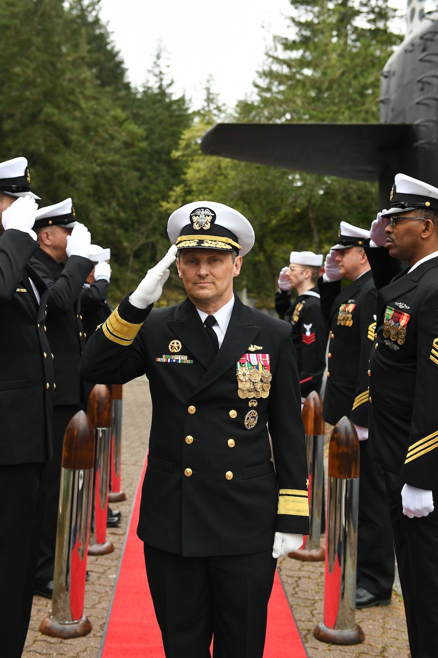 Rear Adm. Chris Cavanaugh, commander, Submarine Force, U.S. Pacific Fleet, arrives to a change of command ceremony at Naval Base Kitsap-Bangor, April 29, 2025. During the ceremony Rear Adm. Christopher Nash relieved Rear Adm. Thomas Wall as commander of Submarine Group (SUBGRU) 9. SUBGRU-9 exercises administrative control authority for assigned submarine commands and units in the Pacific Northwest providing oversight for shipboard training, personnel, supply and material readiness of SSBNs and their crews. SUBGRU-9 is also responsible for nuclear submarines undergoing conversion or overhaul at Puget Sound Naval Shipyard in Bremerton, Washington. (U.S. Navy photo by Mass Communication Specialist 2nd Class Gwendelyn L. Ohrazda)