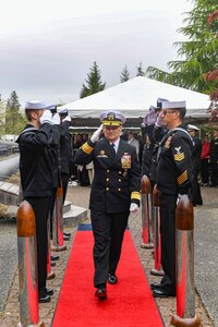 Rear Adm. Chris Cavanaugh, commander, Submarine Force, U.S. Pacific Fleet, departs a change of command ceremony at Naval Base Kitsap-Bangor, April 29, 2025. During the ceremony Rear Adm. Christopher Nash relieved Rear Adm. Thomas Wall as commander of Submarine Group (SUBGRU) 9. SUBGRU-9 exercises administrative control authority for assigned submarine commands and units in the Pacific Northwest providing oversight for shipboard training, personnel, supply and material readiness of SSBNs and their crews. SUBGRU-9 is also responsible for nuclear submarines undergoing conversion or overhaul at Puget Sound Naval Shipyard in Bremerton, Washington. (U.S. Navy photo by Mass Communication Specialist 2nd Class Gwendelyn L. Ohrazda)