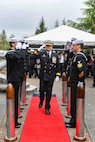 Rear Adm. Christopher Nash, commander, Submarine Group (SUBGRU) 9, departs a change of command ceremony at Naval Base Kitsap-Bangor, April 29, 2025. During the ceremony Nash relieved Rear Adm. Thomas Wall as commander of SUBGRU-9. SUBGRU-9 exercises administrative control authority for assigned submarine commands and units in the Pacific Northwest providing oversight for shipboard training, personnel, supply and material readiness of SSBNs and their crews. SUBGRU-9 is also responsible for nuclear submarines undergoing conversion or overhaul at Puget Sound Naval Shipyard in Bremerton, Washington. (U.S. Navy photo by Mass Communication Specialist 2nd Class Gwendelyn L. Ohrazda)