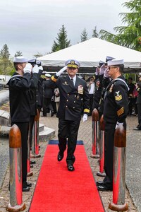 Rear Adm. Christopher Nash, commander, Submarine Group (SUBGRU) 9, departs a change of command ceremony at Naval Base Kitsap-Bangor, April 29, 2025. During the ceremony Nash relieved Rear Adm. Thomas Wall as commander of SUBGRU-9. SUBGRU-9 exercises administrative control authority for assigned submarine commands and units in the Pacific Northwest providing oversight for shipboard training, personnel, supply and material readiness of SSBNs and their crews. SUBGRU-9 is also responsible for nuclear submarines undergoing conversion or overhaul at Puget Sound Naval Shipyard in Bremerton, Washington. (U.S. Navy photo by Mass Communication Specialist 2nd Class Gwendelyn L. Ohrazda)