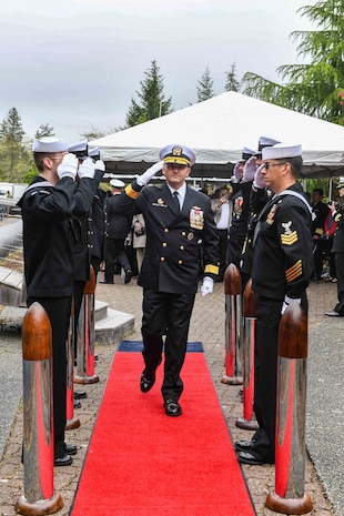 Rear Adm. Christopher Nash, commander, Submarine Group (SUBGRU) 9, departs a change of command ceremony at Naval Base Kitsap-Bangor, April 29, 2025. During the ceremony Nash relieved Rear Adm. Thomas Wall as commander of SUBGRU-9. SUBGRU-9 exercises administrative control authority for assigned submarine commands and units in the Pacific Northwest providing oversight for shipboard training, personnel, supply and material readiness of SSBNs and their crews. SUBGRU-9 is also responsible for nuclear submarines undergoing conversion or overhaul at Puget Sound Naval Shipyard in Bremerton, Washington. (U.S. Navy photo by Mass Communication Specialist 2nd Class Gwendelyn L. Ohrazda)