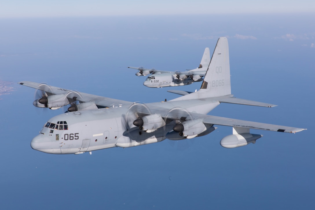 U.S. Marine Corps KC-130J Super Hercules aircraft with Marine Aerial Refueler Transport Squadron (VMGR) 152 fly in formation above Japan, Dec. 23, 2021. Marines with VMGR-152 conducted a simultaneous large-scale launch of multiple aircraft and practiced training scenarios that included formation flying, simulated aerial delivery and tactical landings. (U.S. Marine Corps photo by Lance Cpl. Tyler Harmon)