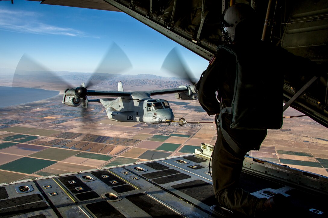 U.S. Marine Corps Cpl. Seth Witherup, a crewmaster with Marine Aerial Refueler Transport Squadron (VMGR) 152, observes an MV-22B Osprey with Marine Medium Tiltrotor Squadron (VMM) 263 conduct air-to-air refueling during unit-level training called El Centro Horizon at Naval Air Facility El Centro, California, Dec. 6, 2017. VMGR-152’s mission is to support the Marine Air-Ground Task Force commander by providing aerial refueling and assault support, day or night, under all-weather conditions during expeditionary, joint or combined operations. El Centro Horizon provides VMGR-152 with more opportunities to increase squadron combat readiness through the diverse training ranges available in the area. (U.S. Marine Corps photo by Cpl. Carlos Jimenez)