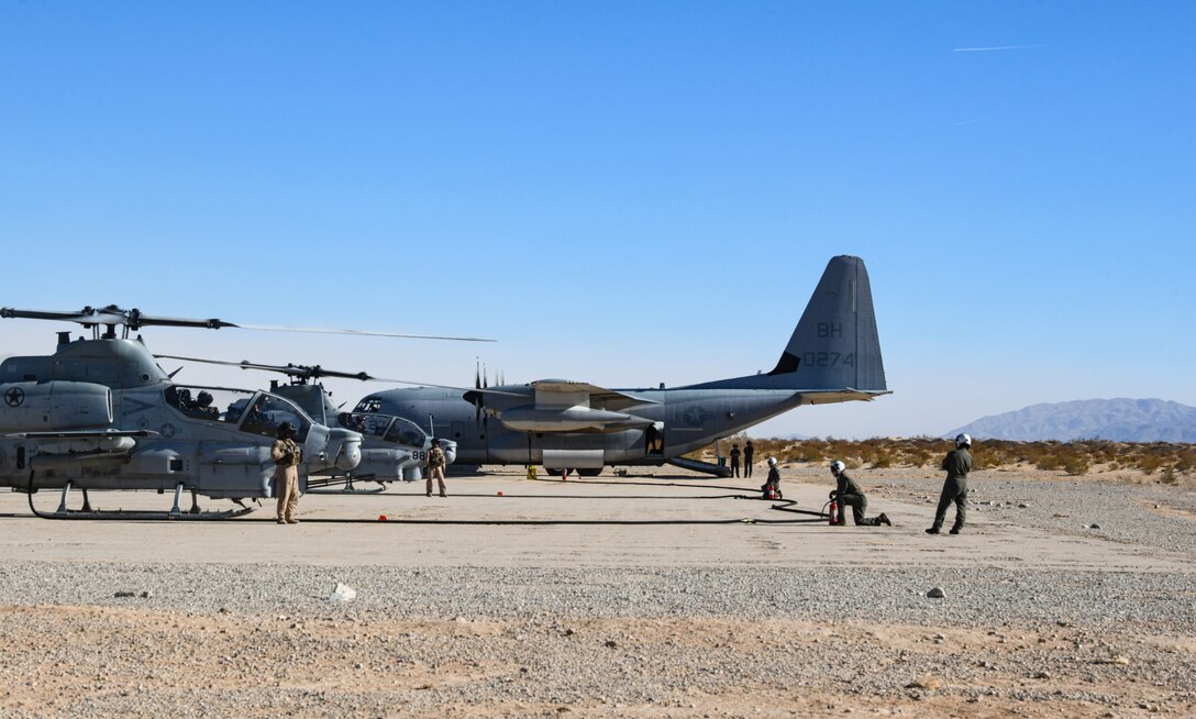 A U.S. Marine Corps KC-130J Super Hercules aircraft with Marine Aerial Refueler Transport Squadron (VMGR) 152, Marine Aircraft Group 12, 1st Marine Aircraft Wing stages on the flight line as U.S. Marines with VMGR-152 prepare for an aviation-delivered ground refueling exercise at Marine Corps Air Ground Combat Center Twentynine Palms, California, Jan. 24, 2025. VMGR-152 traveled from Japan to Arizona for more diverse training opportunities in the Western United States. This training aimed to enhance the squadron’s ability to operate in various environments and refresh the Marines’ qualifications. (U.S. Marine Corps photo by Lance Cpl. Eliza Fremont)