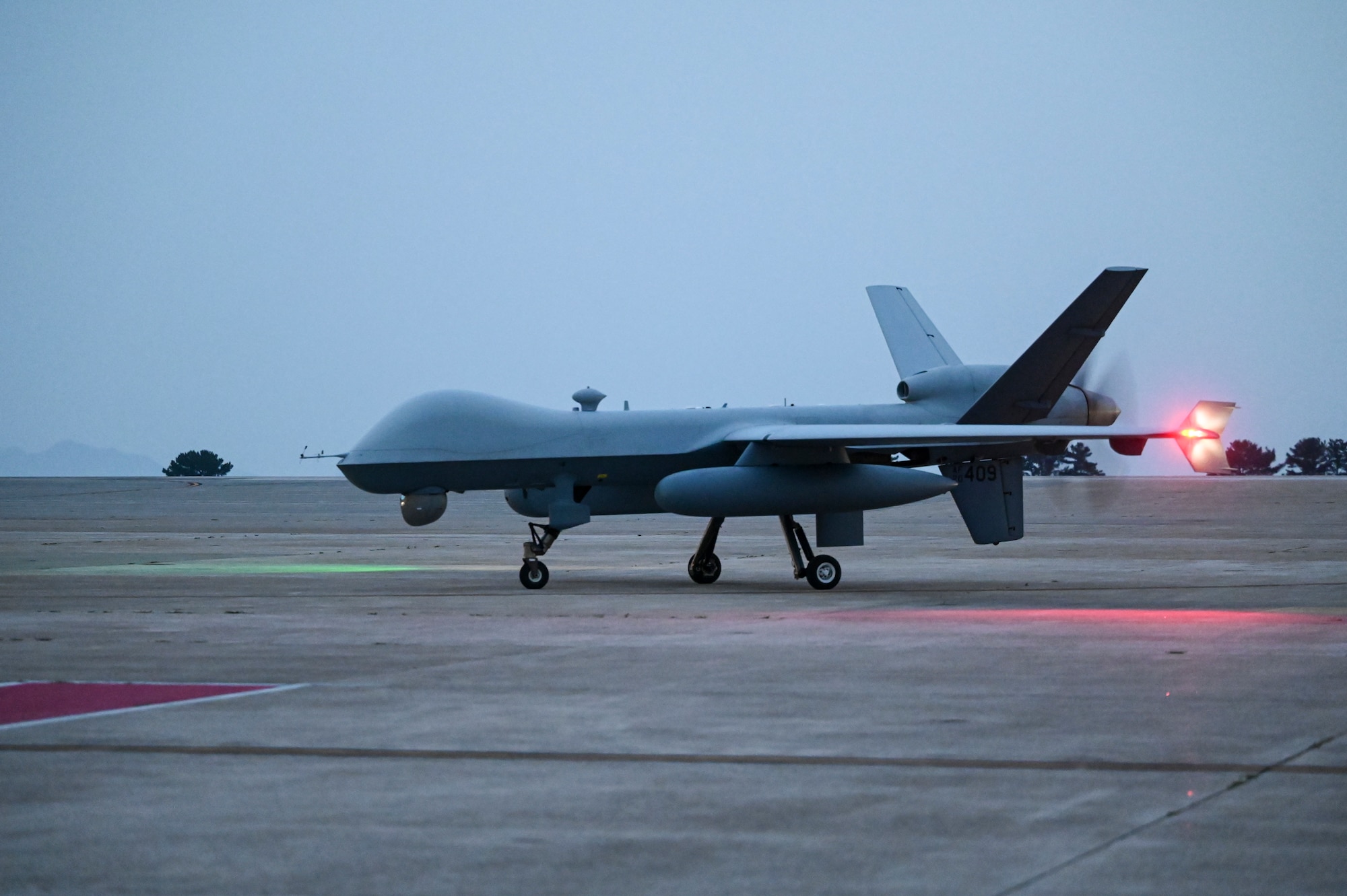 An MQ-9 Reaper taxis across the runway after arriving to support exercise Freedom Flag 25-1 at Kunsan Air Base, Republic of Korea, April 17, 2025.