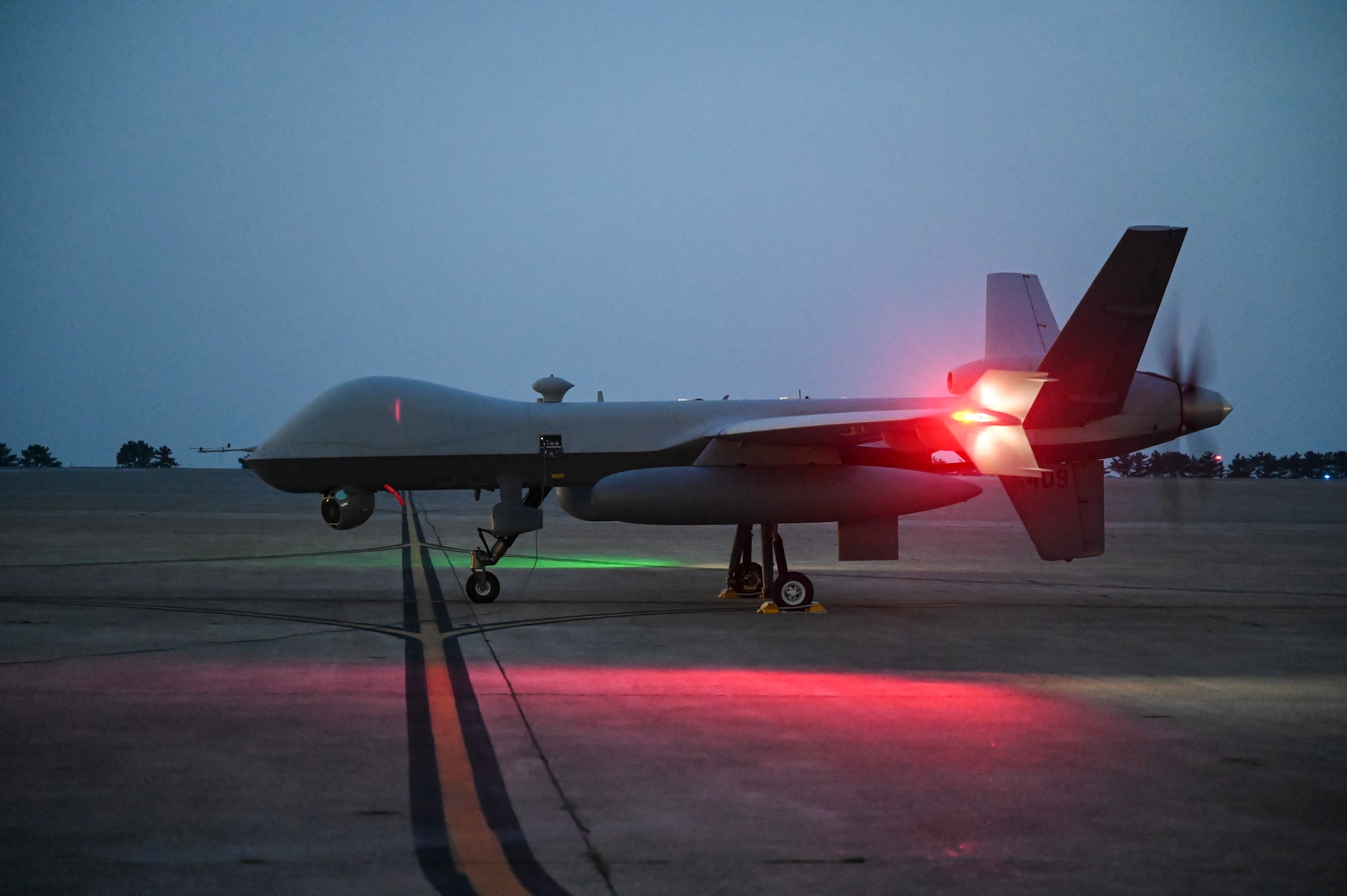 An MQ-9 Reaper taxis across the runway after arriving to support exercise Freedom Flag 25-1 at Kunsan Air Base, Republic of Korea, April 17, 2025.