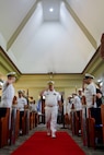 Capt. Robert R. Williams, outgoing commander, Military Sealift Command Far East, gets piped aboard during a change of command ceremony at the Singapore Naval Installation in Sembawang, April 30, 2025