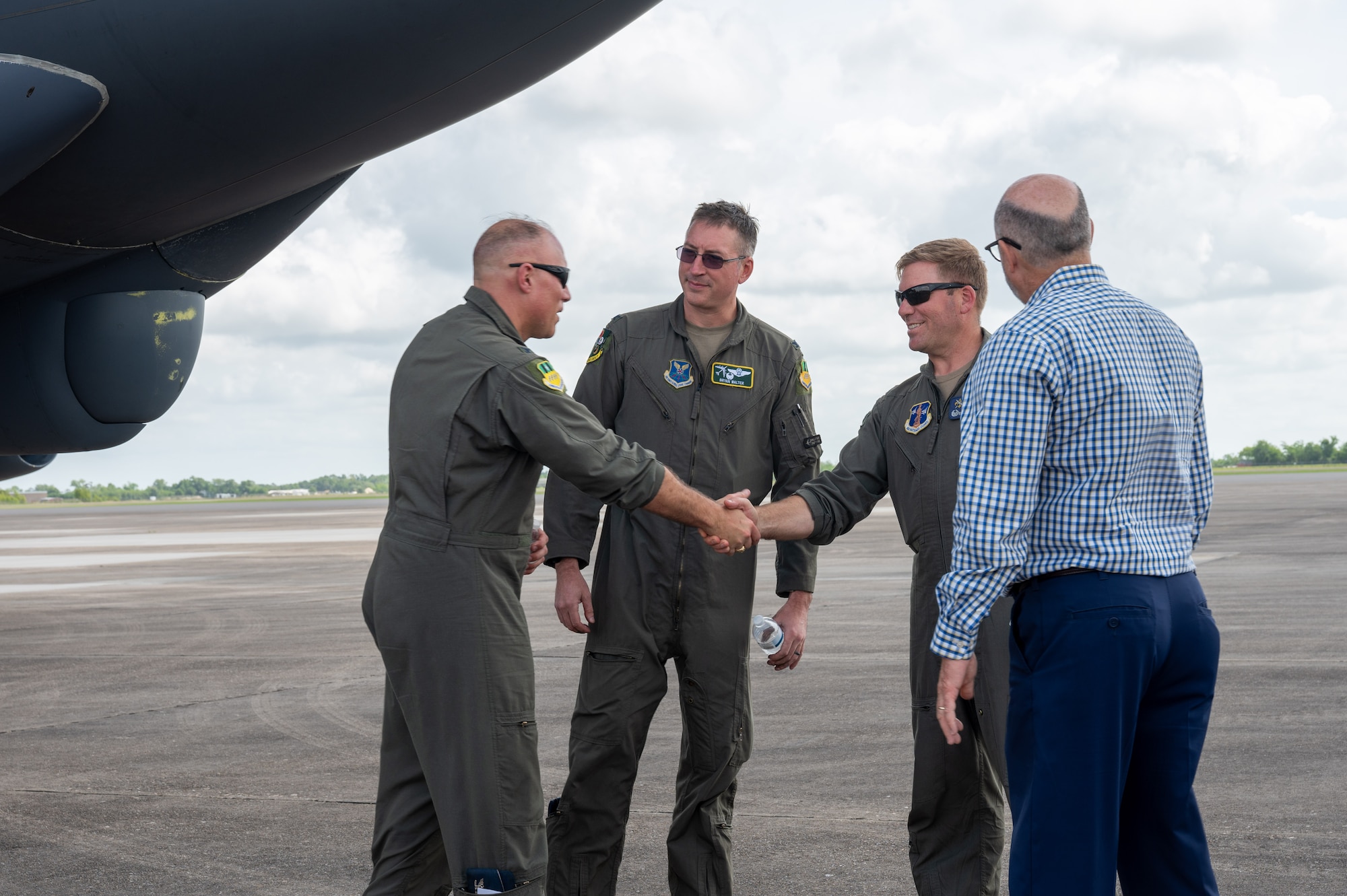 U.S. Air Force Col. Michael Maginness, 2nd Bomb Wing commander, greets Col. David Anderson, 159th Fighter Wing commander, after landing at Chennault International Airport in Lake Charles, La., April 29, 2025. Leadership from the 2nd Bomb Wing and 159th Fighter Wing conducted tactical training together and toured the local facilities to assess how the units could utilize the facilities for future training.  (U.S. Air Force photo by Senior Airman Seth Watson)