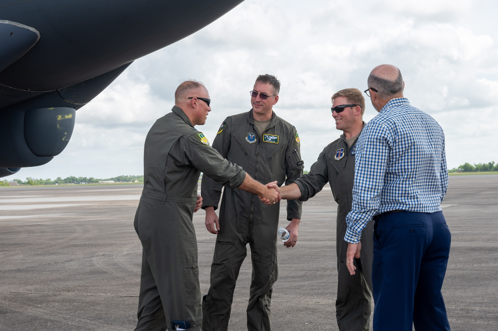 U.S. Air Force Col. Michael Maginness, 2nd Bomb Wing commander, greets Col. David Anderson, 159th Fighter Wing commander, after landing at Chennault International Airport in Lake Charles, La., April 29, 2025. Leadership from the 2nd Bomb Wing and 159th Fighter Wing conducted tactical training together and toured the local facilities to assess how the units could utilize the facilities for future training.  (U.S. Air Force photo by Senior Airman Seth Watson)