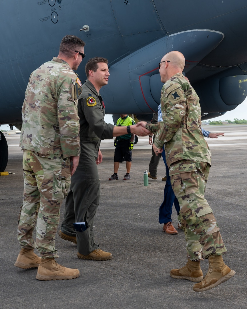 U.S Air Force Lt. Col. Matthew Dougherty, 96th Bomb Squadron commander, greets Lt. Col. Stephen Luebbert,  Louisiana Army National Guard Global Force Information Management Operations branch chief, after landing at Chennault International Airport in Lake Charles, La., April 29, 2025. The visit was part of a joint integration effort between the 2nd Bomb Wing, 159th Fighter Wing, and the Louisiana Army National Guard to strengthen interoperability and explore future operational opportunities at Chennault International Airport. (U.S. Air Force photo by Senior Airman Seth Watson)