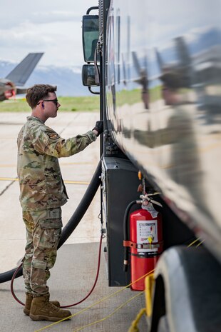 A photo of an Airmen refueling and F-35 from a fuel truck