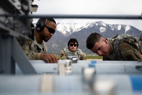 A photo of Airmen loading weapons into an F-35