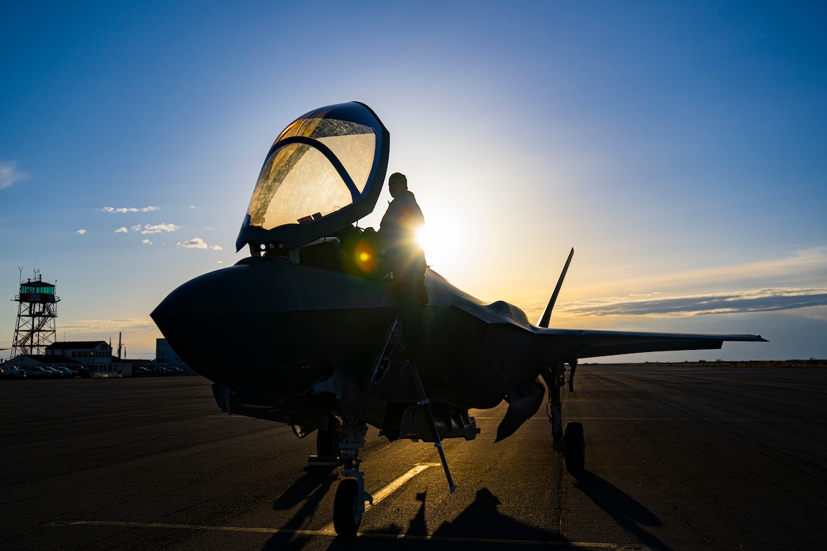 A photo of a pilot climbing into an F-35