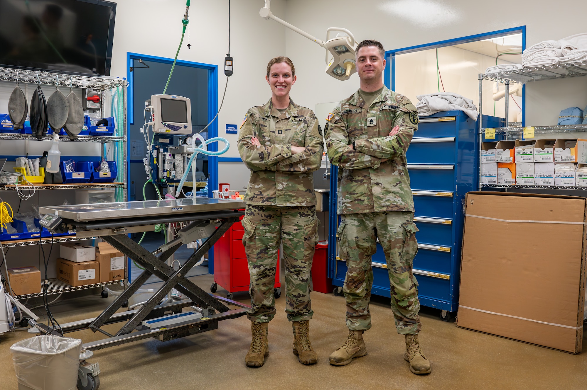 Two service members pose for a photo