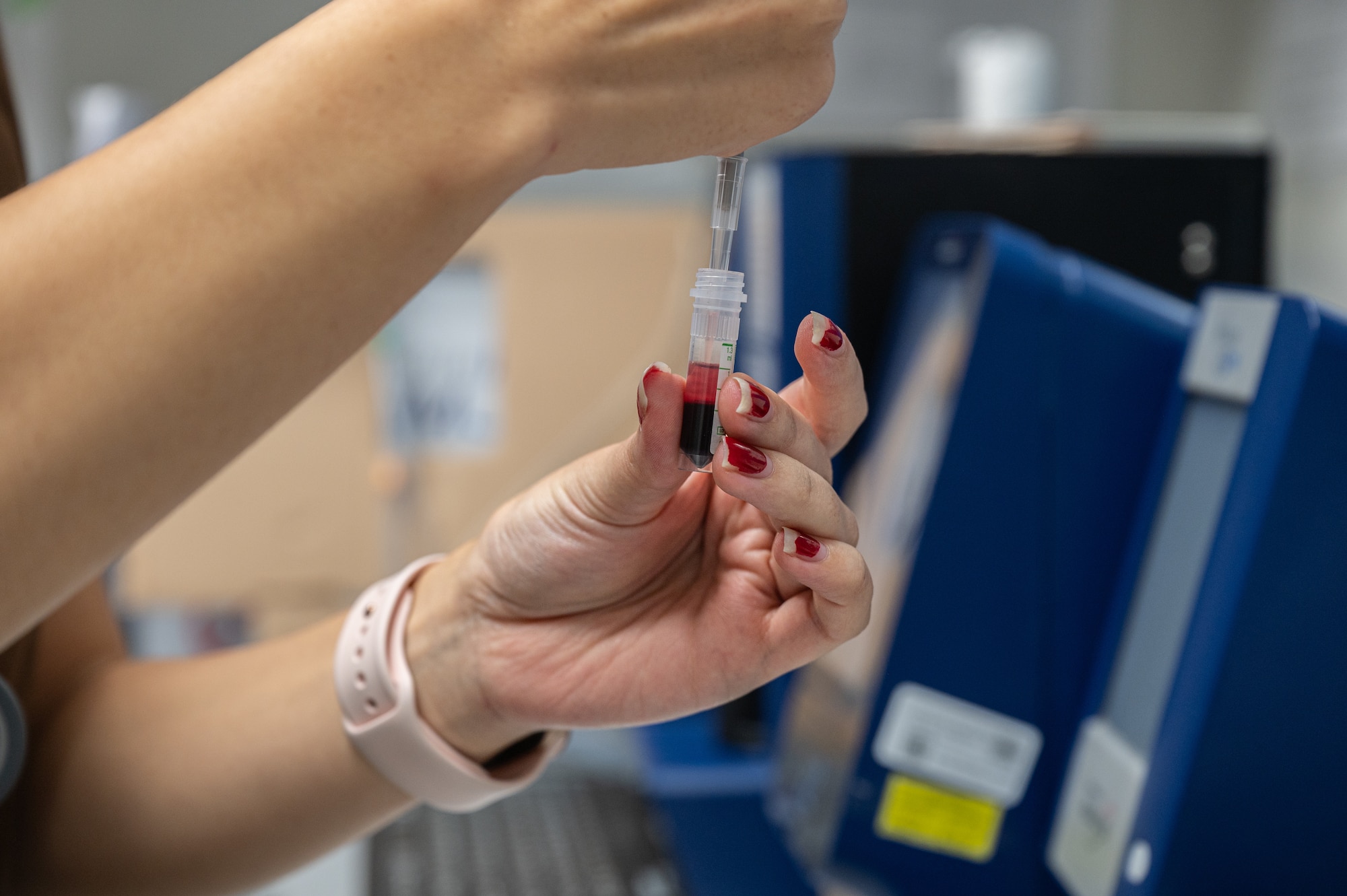 A blood sample is taking out of the vile.