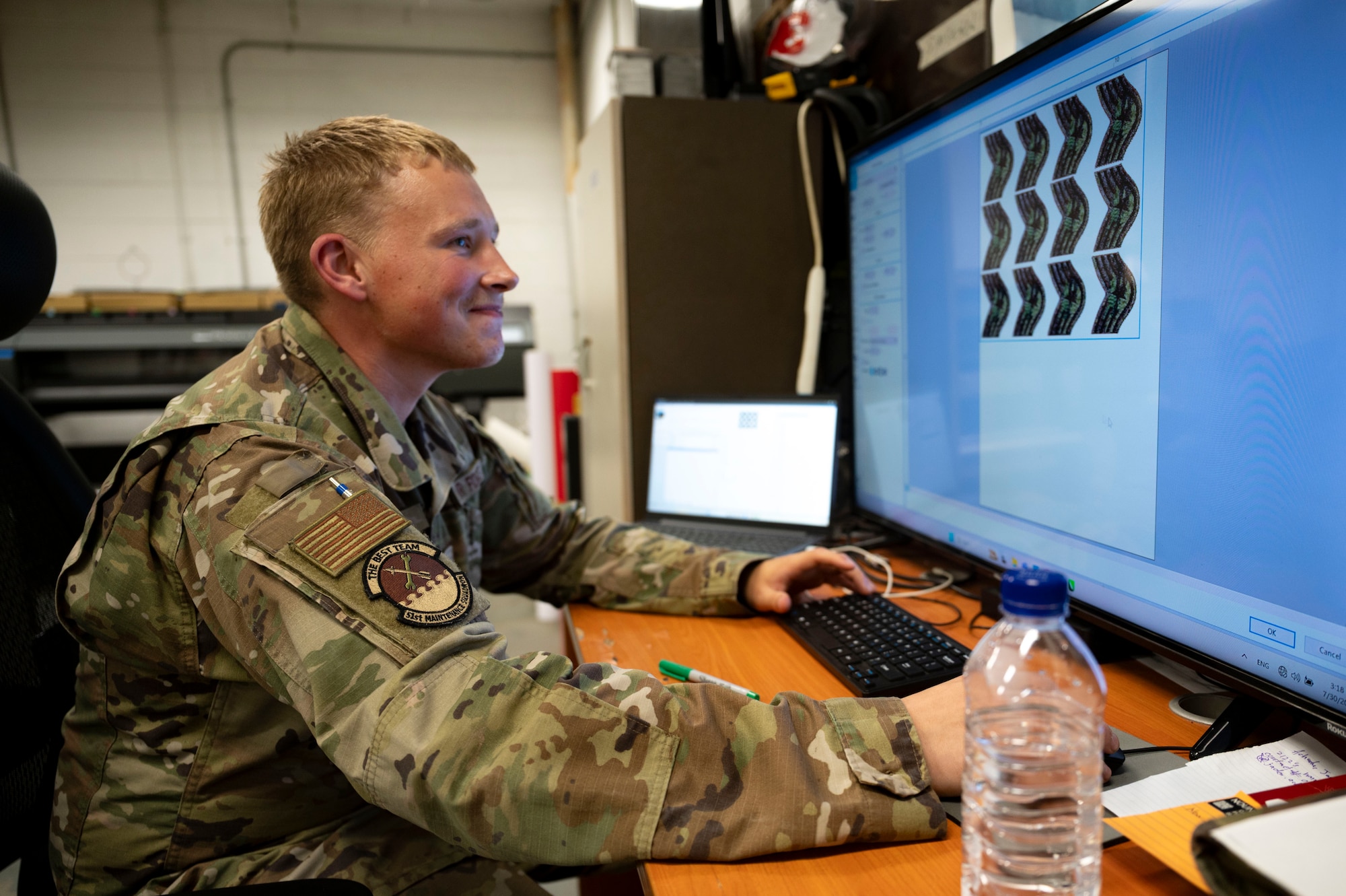 U.S. Air Force Staff Sgt. Bryce Vincent, 51st Maintenance Squadron corrosion control lead, designs custom stencils and memorabilia models at Osan Air Base, Republic of Korea, July 31, 2025.
