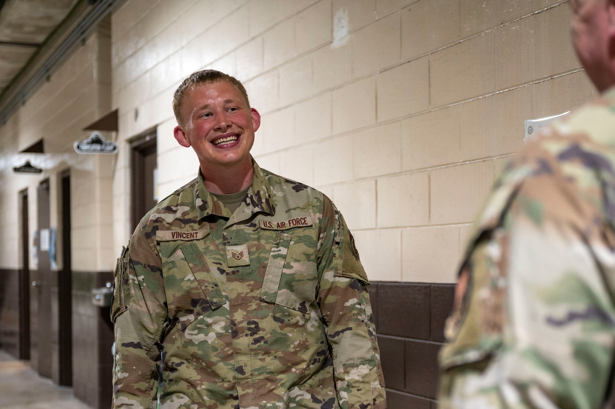 U.S. Air Force Staff Sgt. Bryce Vincent, 51st Maintenance Squadron corrosion control lead, discusses product requests with a customer at Osan Air Base, Republic of Korea, July 31, 2025.