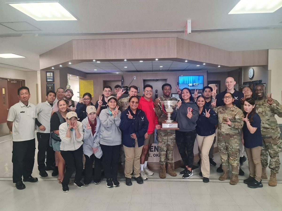 Members of the 18th Force Support Squadron Risner Fitness Center staff pose for a photo after winning the U.S. Air Force fitness and sports program of the year award for 2024 at Kadena Air Base, Japan.
