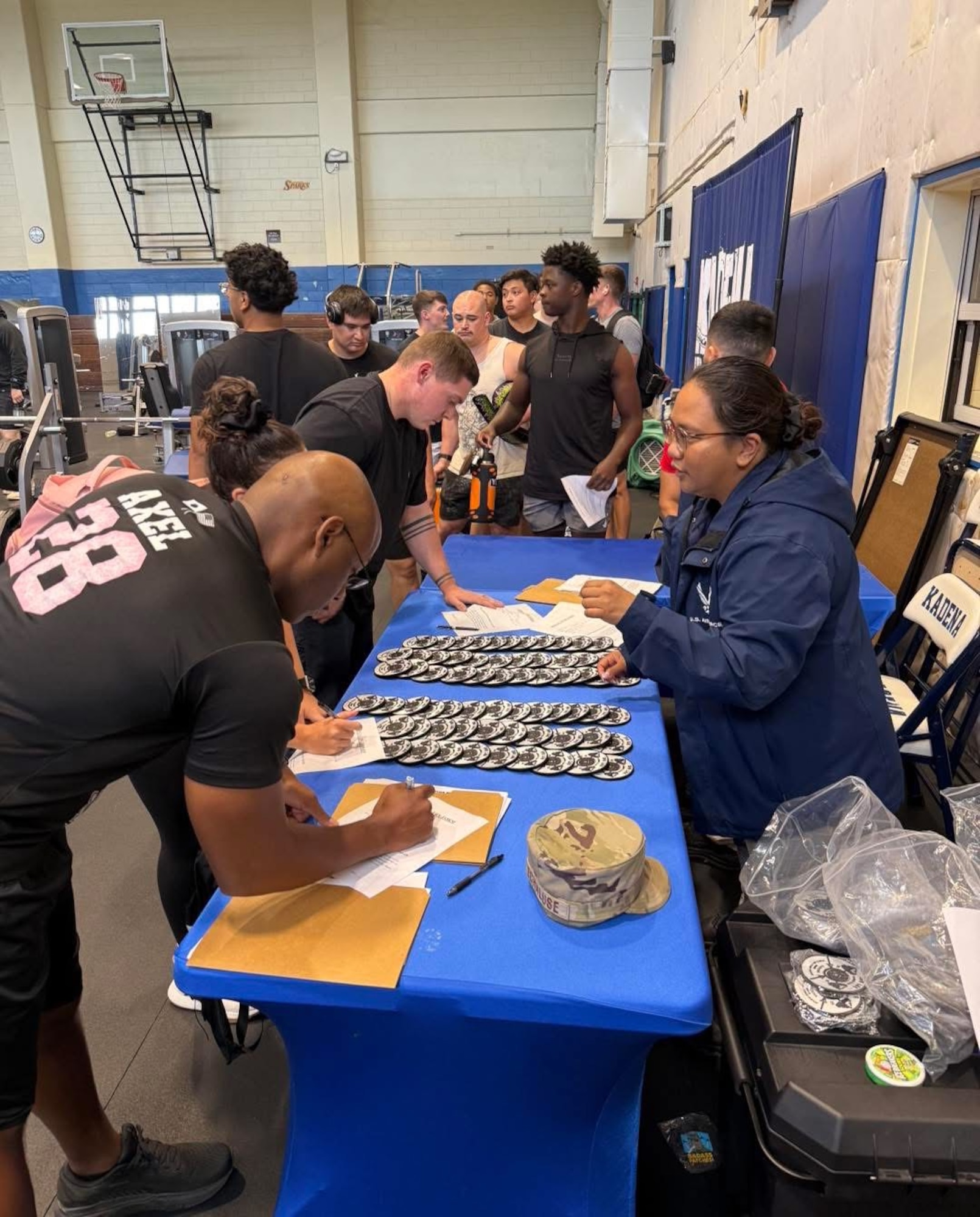 Members of Kadena Air Base sign up for the 1000 pound challenge hosted by the 18th Force Support Squadron at Risner Fitness Center, Kadena Air Base, Japan, May 21, 2025.