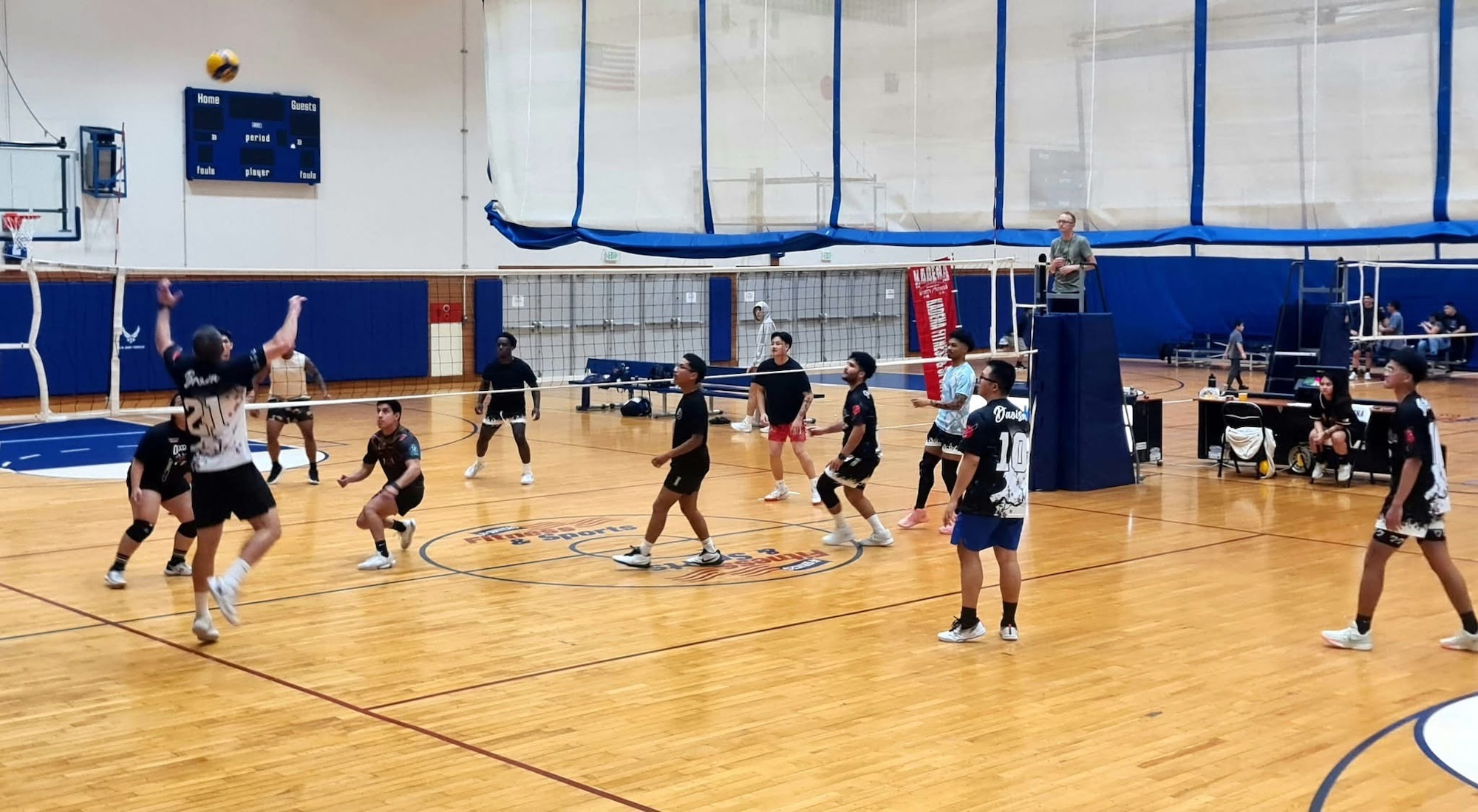 Members of Kadena Air Base play volleyball during Shogun Sports night at Risner Fitness Center, Kadena Air Base, Japan, July 18, 2025