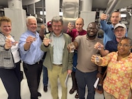 Personnel from the 405th Army Field Support Brigade headquarters toast to safe, potable, clear and tasty drinking water at the SWK Haus des Wassers, or House of Water, in the Palatine Forest just south of Kaiserslautern, Germany, July 31, 2025. The 405th AFSB labor advisor organized a professional development site visit and a private tour of the waterworks facility.