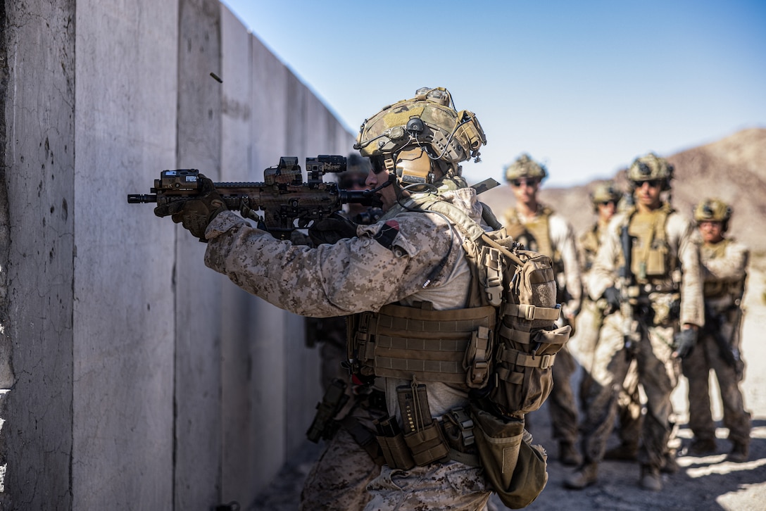 U.S. Marine Corps Sgt. Jacob Miller, a reconnaissance Marine with 2d Reconnaissance Battalion, 2d Marine Division conducts live-fire Close Quarter Tactic training on Range 111 during Service Level Training Exercise 4-25, on Marine Corps Air-Ground Combat Center, Twentynine Palms, California, July 29, 2025. SLTE 4-25 is designed to be a challenging, realistic training environment that produces combat-ready forces capable of operating as an integrated Marine Air Ground Task Force across all domains of military operations. (U.S. Marine Corps photo by Lance Cpl. Judith Ann Lazaro)