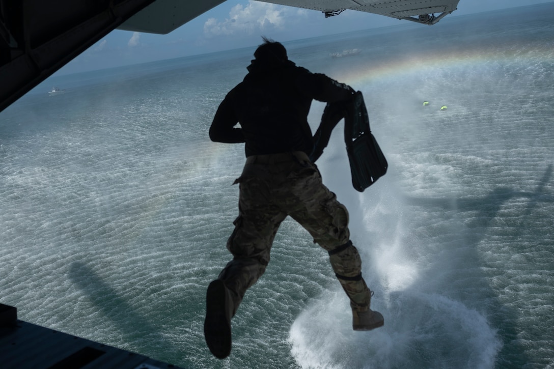 A U.S. Army instructor with Charlie Company 2nd Battalion, U.S. Army Special Warfare Training Group (Airborne), jumps from the back of a U.S. Marine Corps CH-53K King Stallion at U.S. Coast Guard Base Sector Key West, Florida, July 29, 2025. Marines with 2nd Marine Aircraft Wing and 2nd Distribution Support Battalion are training alongside elements of the U.S. Army, U.S. Navy, and U.S. Customs and Border Protection to refine humanitarian assistance and disaster relief capabilities while also refining the CH-53K’s ability to support distributed aviation operations in a joint environment. (U.S. Marine Corps photo by Cpl. Mya Seymour)