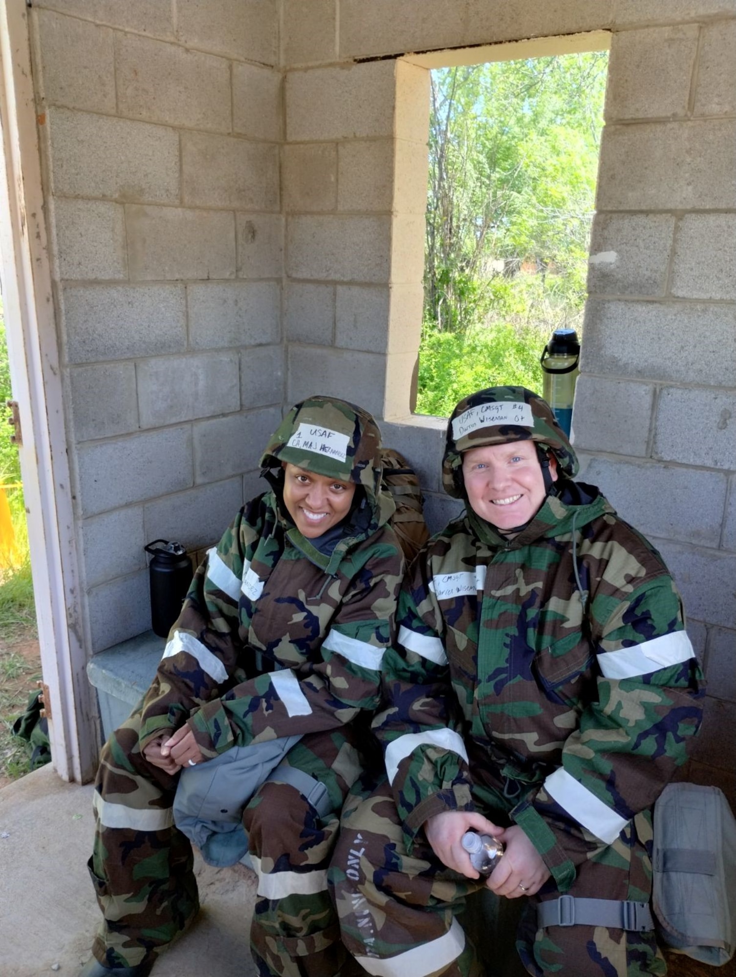 two people pose for photo in military uniform