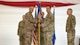 U.S. Air Force Col. Shaun Westphal, 5th Medical Group (5MDG) commander, presents the guidon to U.S. Air Force Col. Jesse Lamarand, 5th Bomb Wing commander, during the 5MDG change of command ceremony at Minot Air Force Base, North Dakota, July 31, 2025. The passing of the guidon to Lamarand represents the transition of power to the next commander.