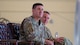 U.S. Air Force Col. Shaun Westphal, outgoing 5th Medical Group (5MDG) commander (left), and U.S. Air Force Col. Michael McCarthy (right), incoming 5MDG commander, sit next to each other during the 5MDG change of command ceremony at Minot Air Force Base, North Dakota, July 31, 2025. During the ceremony, Westphal relinquished command to McCarthy.