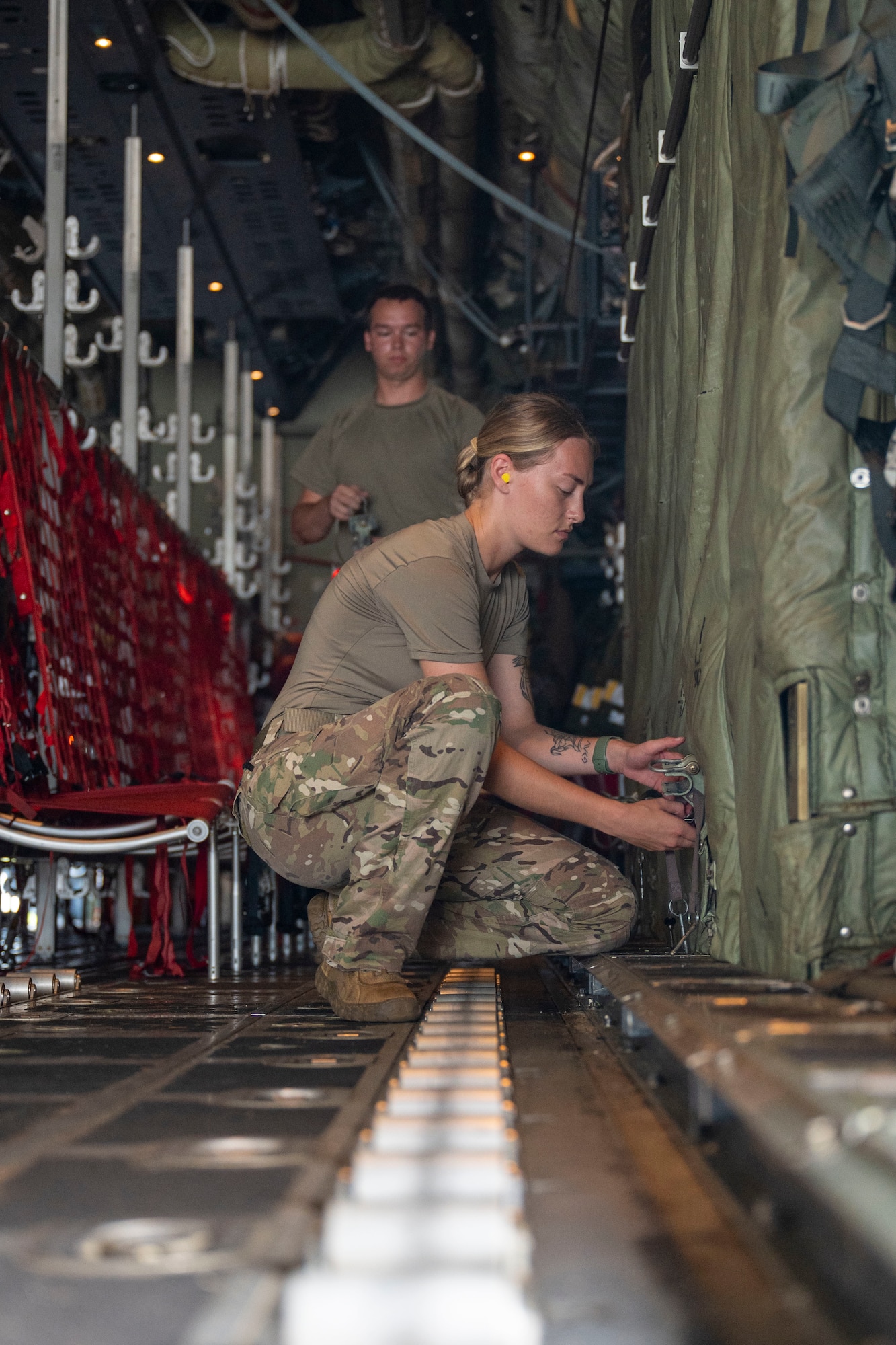 Airmen fly on a C-130J in Guam