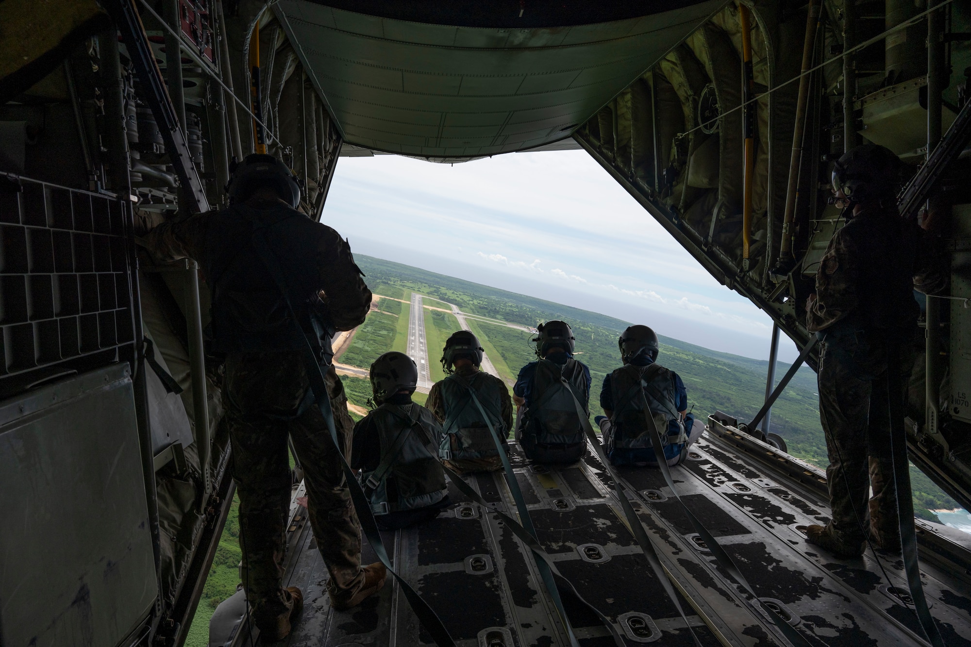 Airmen fly on a C-130J in Guam