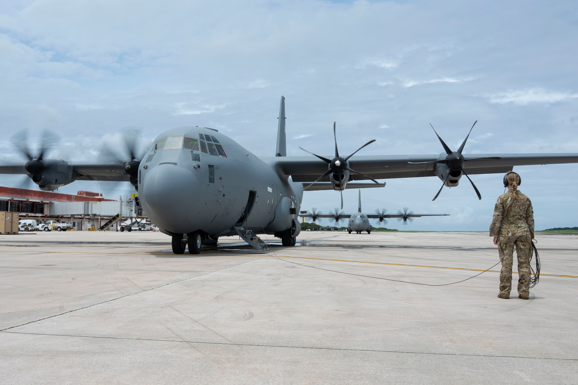 Airmen fly on a C-130J in Guam