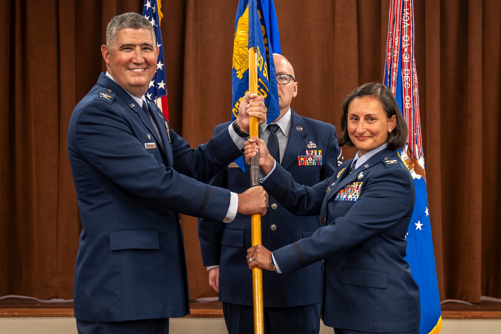 Col Stremmel and Col Malesra holding guidon