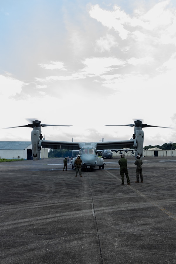 U.S. Marines with Marine Rotational Force – Darwin 25.3 prepare an MV-22B Osprey assigned to Marine Medium Tiltrotor Squadron (VMM) 363 for delivery of food supplies to aid in urgent lifesaving support  at Clark Air Base, Angeles, Philippines, July 29, 2025. At the request of the Government of the Philippines, U.S. Marines with the MRF-D 25.3 Marine Air-Ground Task Force are working alongside the Armed Forces of the Philippines to provide urgent lifesaving support to communities affected by consecutive storms and the southwest monsoon. The forward presence and ready posture of United States Indo-Pacific Command in the region facilitates rapid and effective response to crisis, demonstrating the U.S.’s commitment to Allies and partners during times of need. (U.S. Marine Corps caption by Sgt. Khalil Brown)