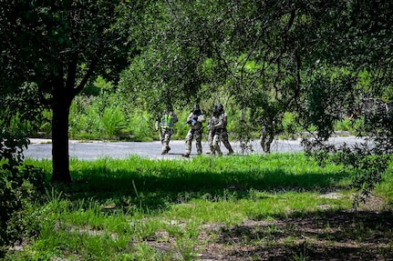Members from the U.S. Air Force 11th Security Forces Squadronprepare to engage during a close-quarters combat training exercise at Joint Base Andrews, Md., July 22, 2025.