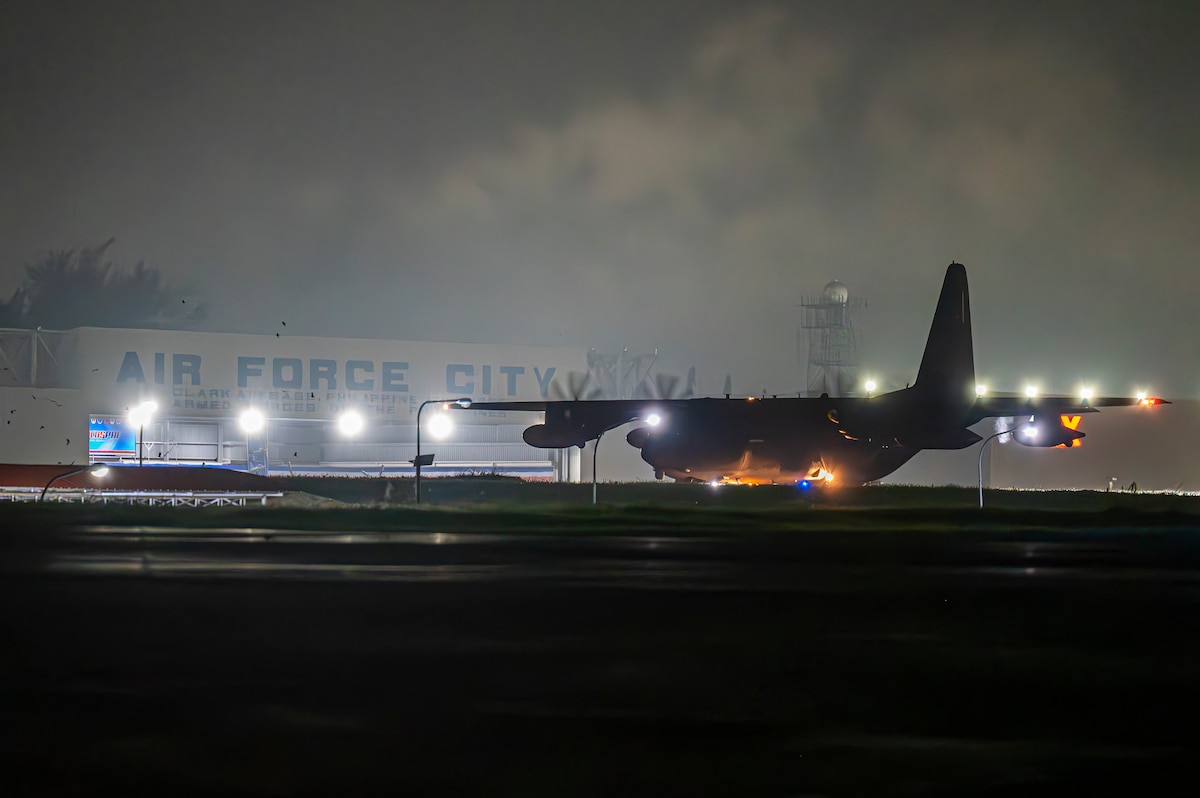 An MC-130J Commando II taxis on the runway on Clark Air Base.