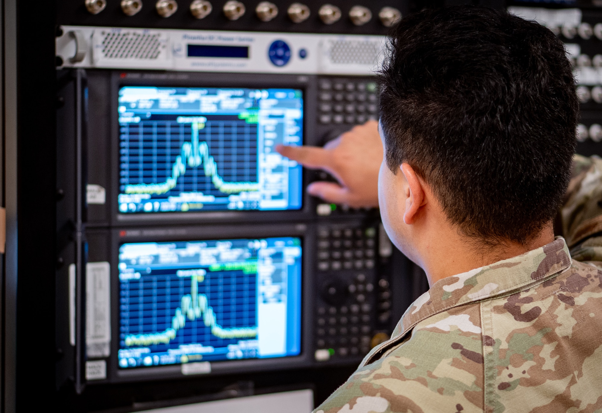 Airman working electronics equipment