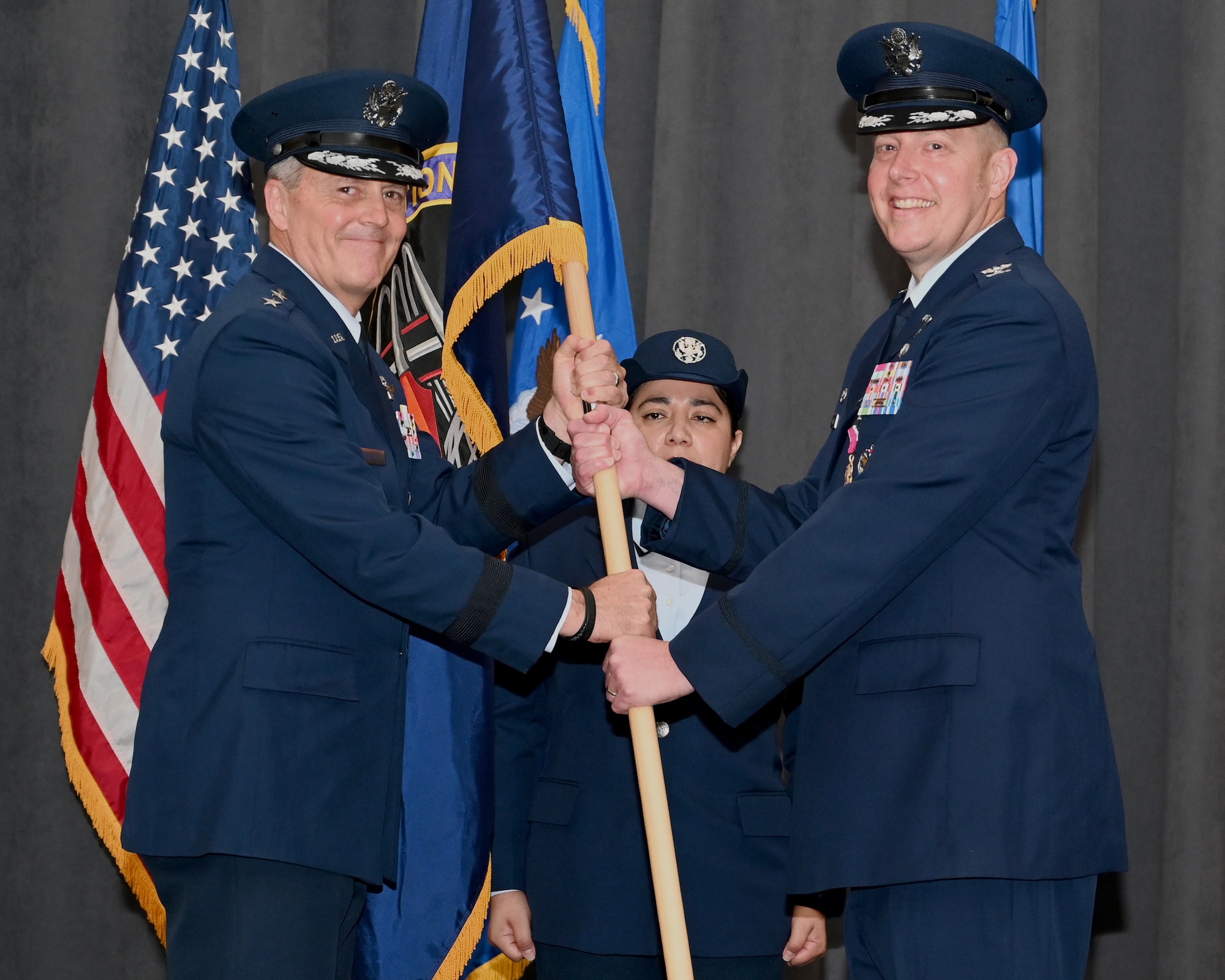 Maj. Gen. Jason Armagost, Eighth Air Force and Joint-Global Strike Operations Center commander, poses for a picture after receiving the guidon from Col. Ryan Gorecki